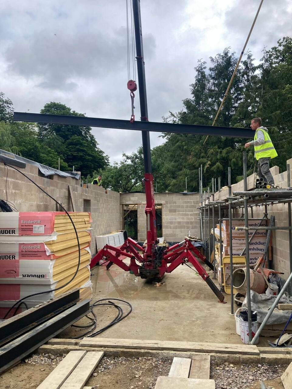 Crane lifting structural steelwork into place