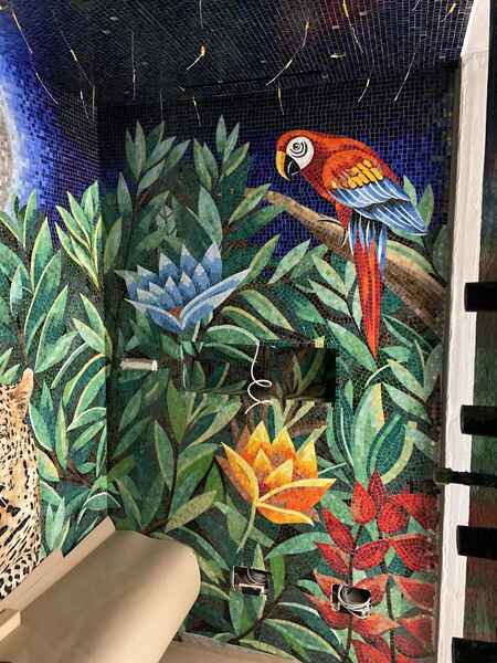 Bold mosaic tile mural in a shower room